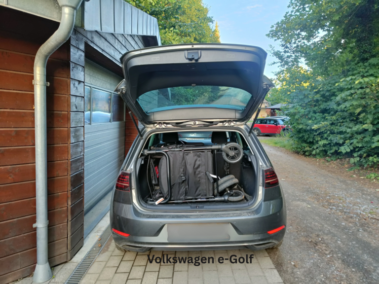 Arkonno stroller wagon folded into the trunk of a VW Golf